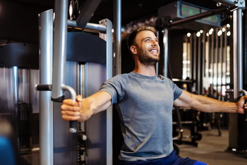 man-with-weight-training-equipment-exercising-in-s-2023-11-27-05-33-11-utc-1.webp